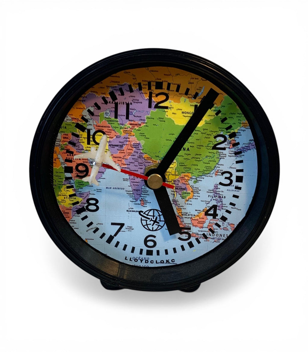 Table clock with travelling design background