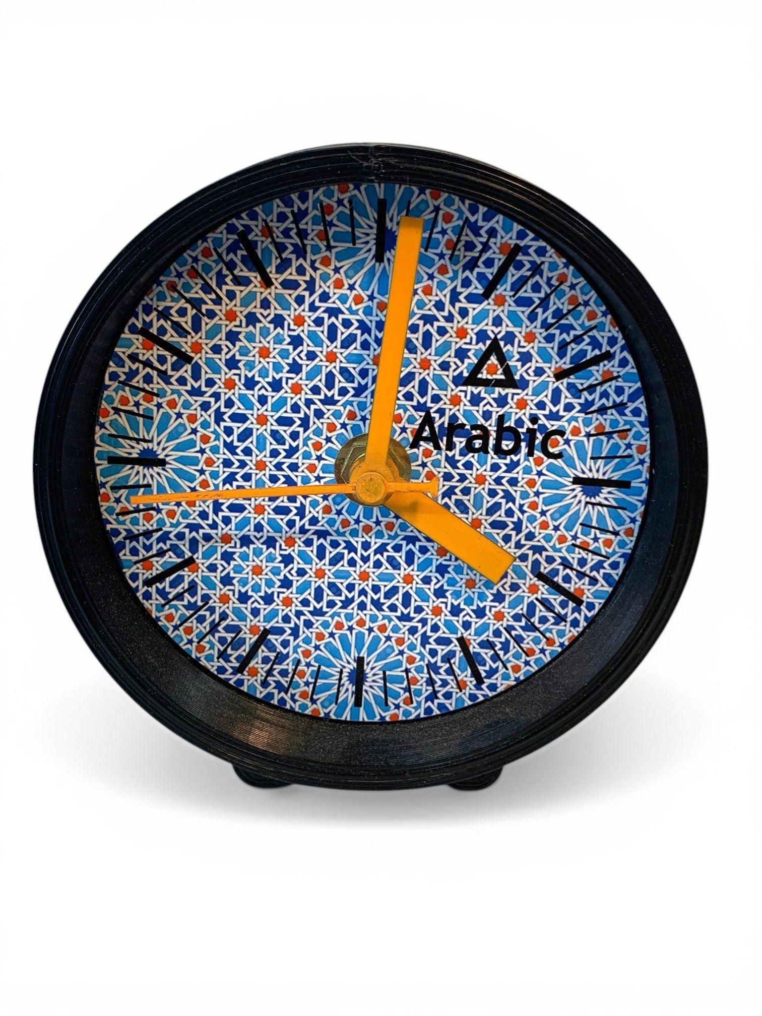 Table clock with geometric arabic designs