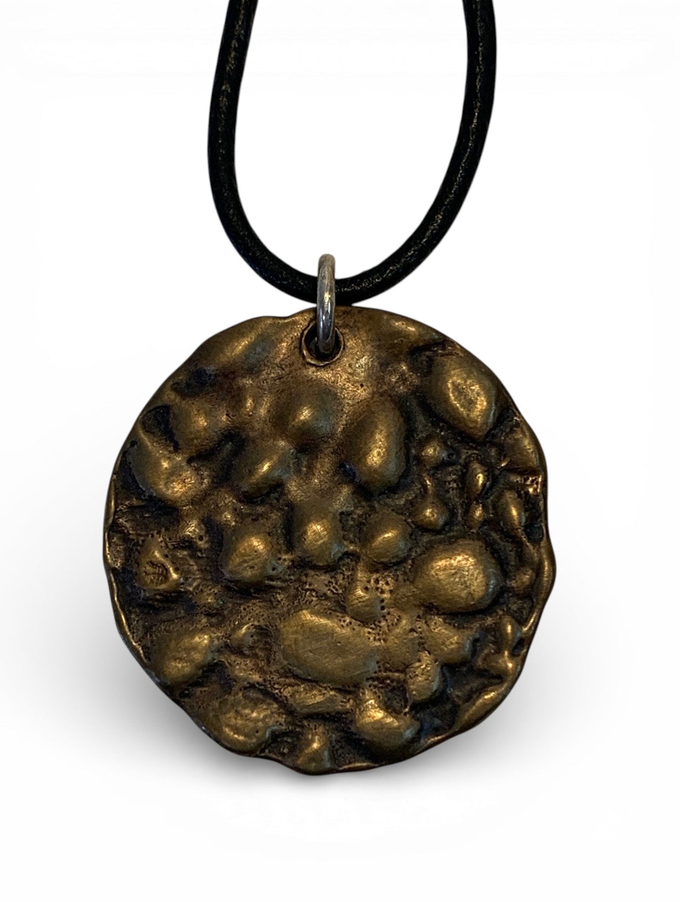 Bronze pendant with polish finishing and leather chain