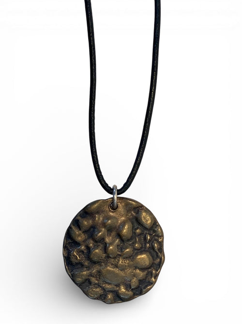 Bronze pendant with polish finishing and leather chain
