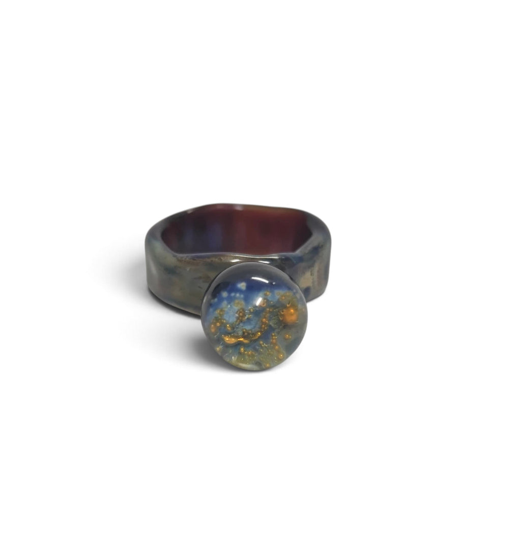 Borosilicate glass ring with a galaxy-like sphere in blue and gold