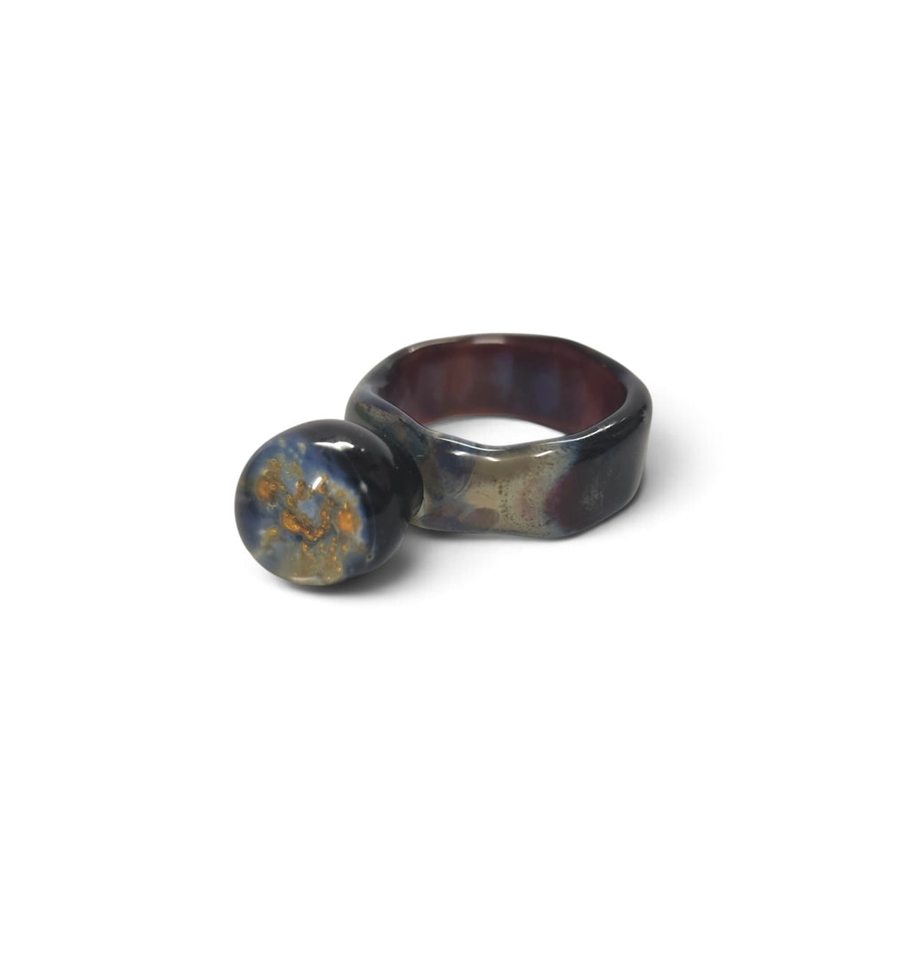 Side view of the iridescent glass ring and its sphere