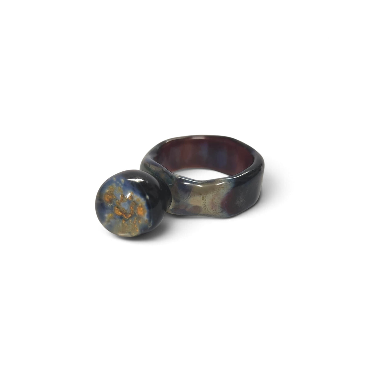 Side view of the iridescent glass ring and its sphere