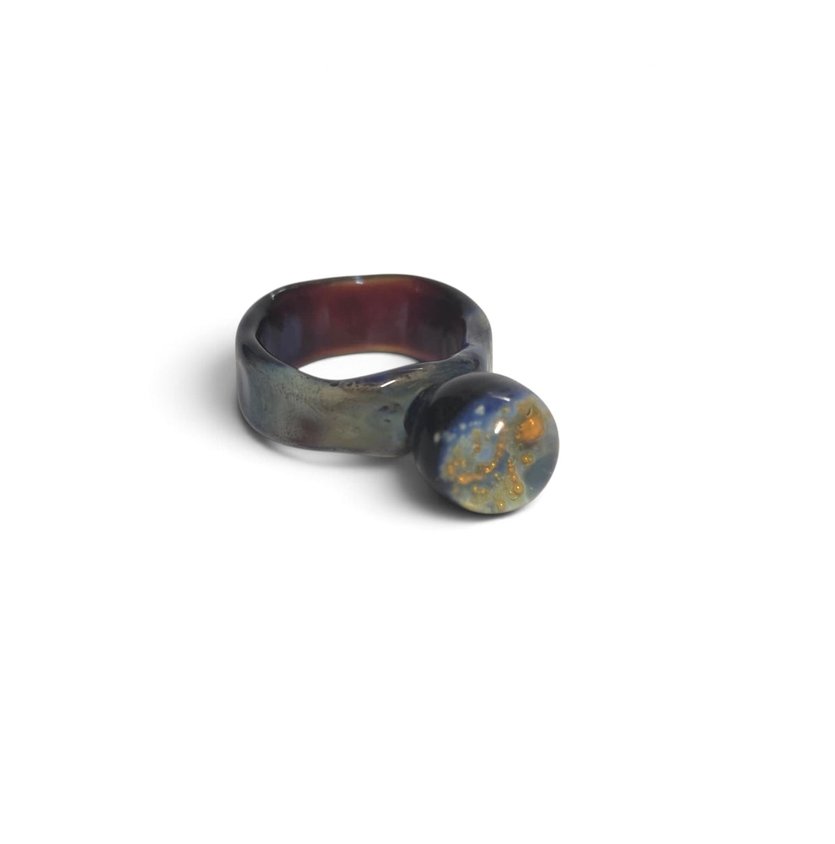 Glass ring band with blue, violet and bronze reflections