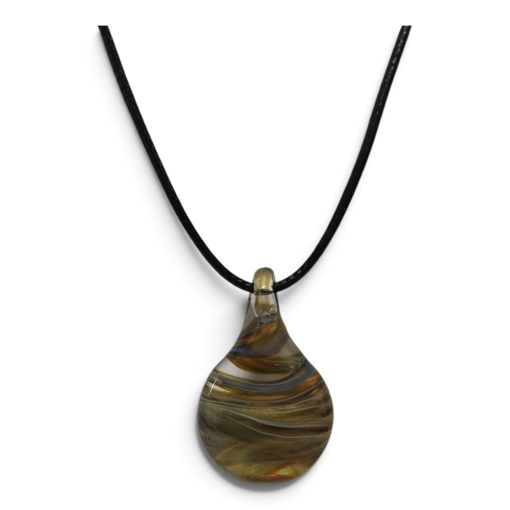 Close-up of the ochre, olive and blue swirls inside the glass teardrop