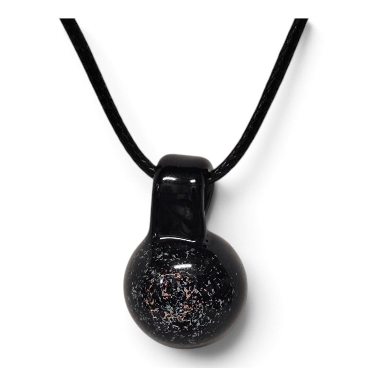 Close-up of the dichroic flecks shimmering over the black glass