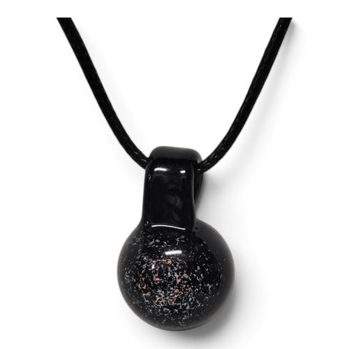 Close-up of the dichroic flecks shimmering over the black glass